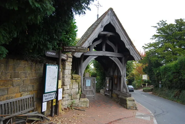 The lych gate at Speldhurst church, with the village notice board.