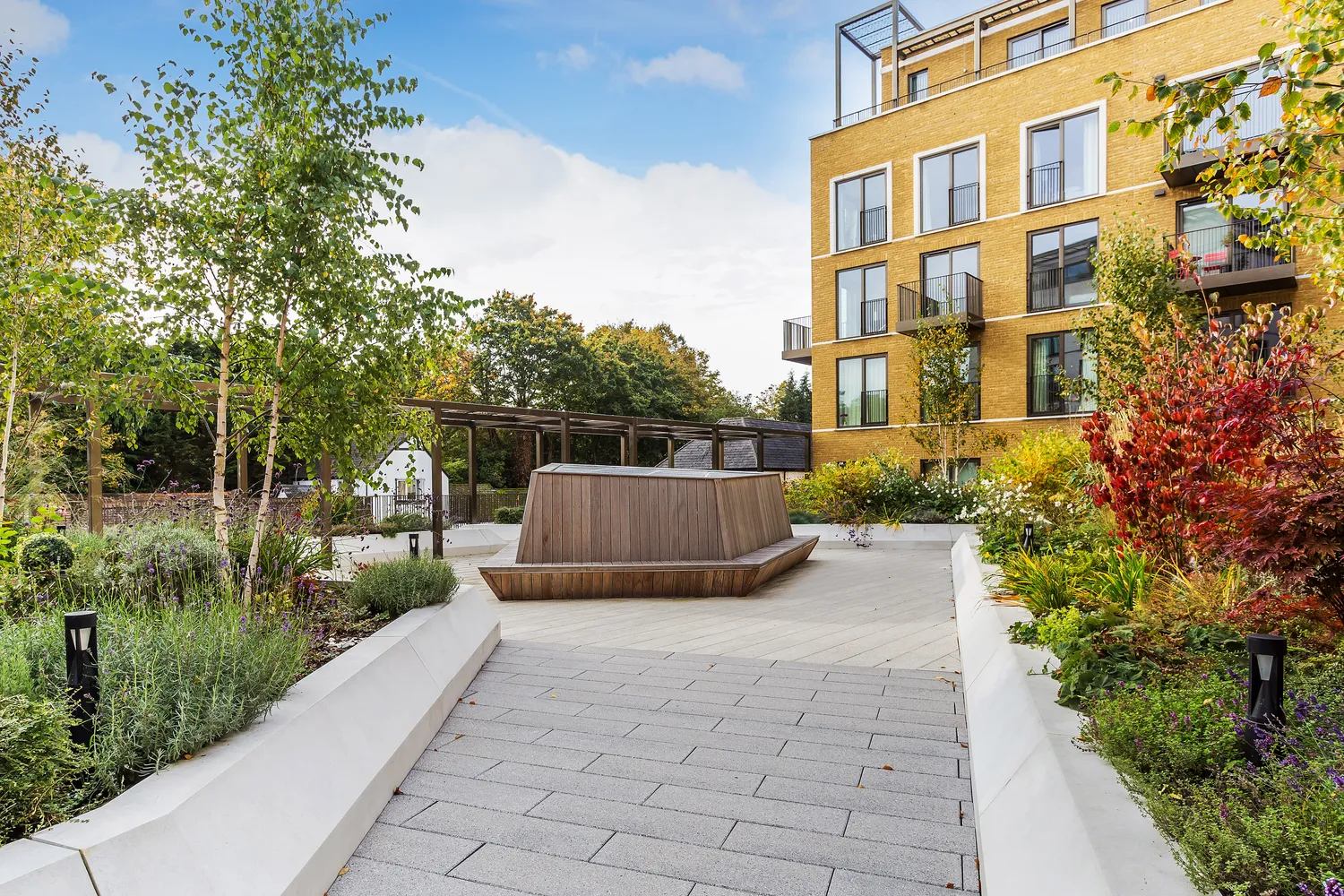 A smart modern apartment building with landscaped grounds, of the kind let through Kings Estates in the Tunbridge Wells area