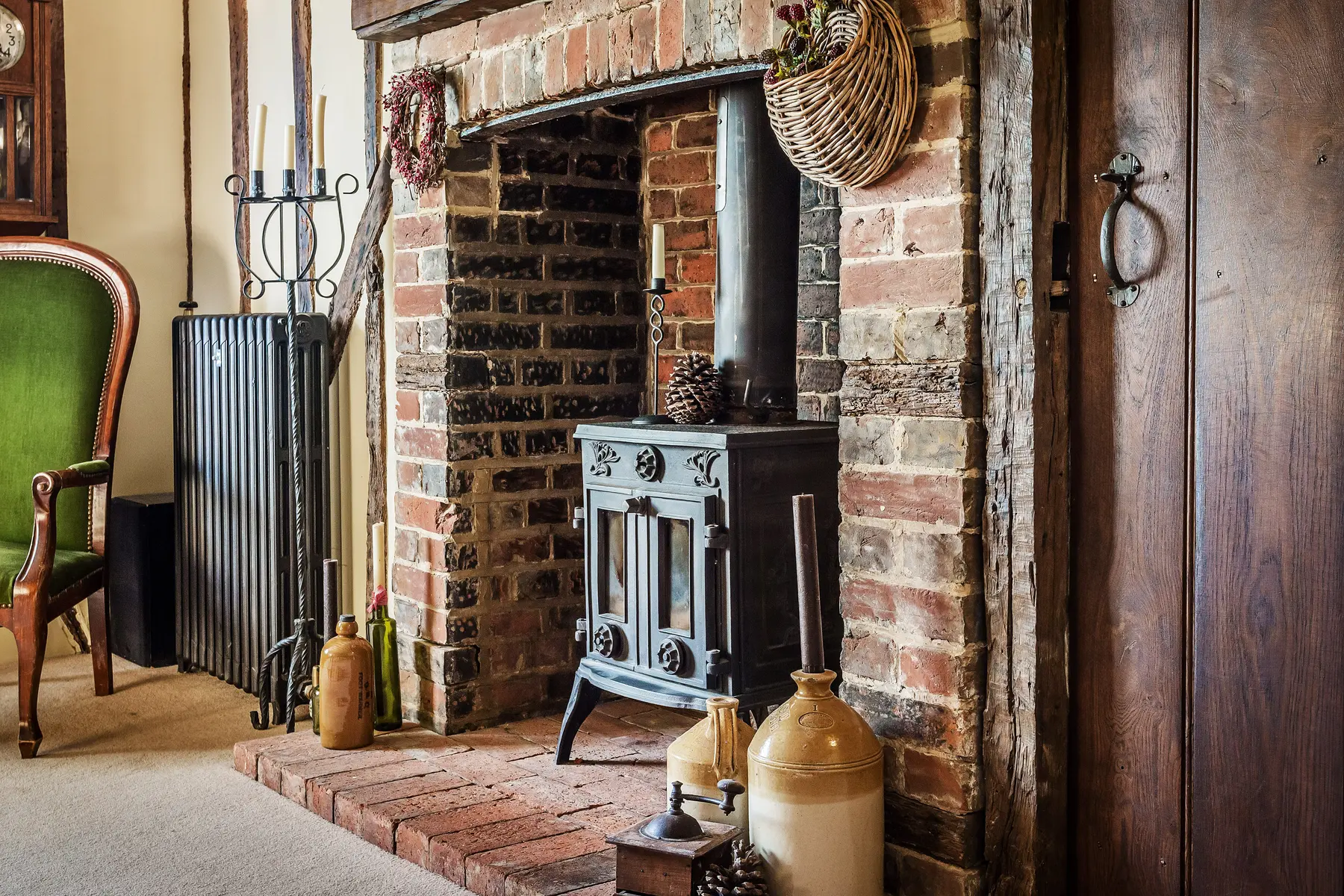 A characterful exposed-brick inglenook with a cast-iron wood-burning stove in a period Kings Estates home