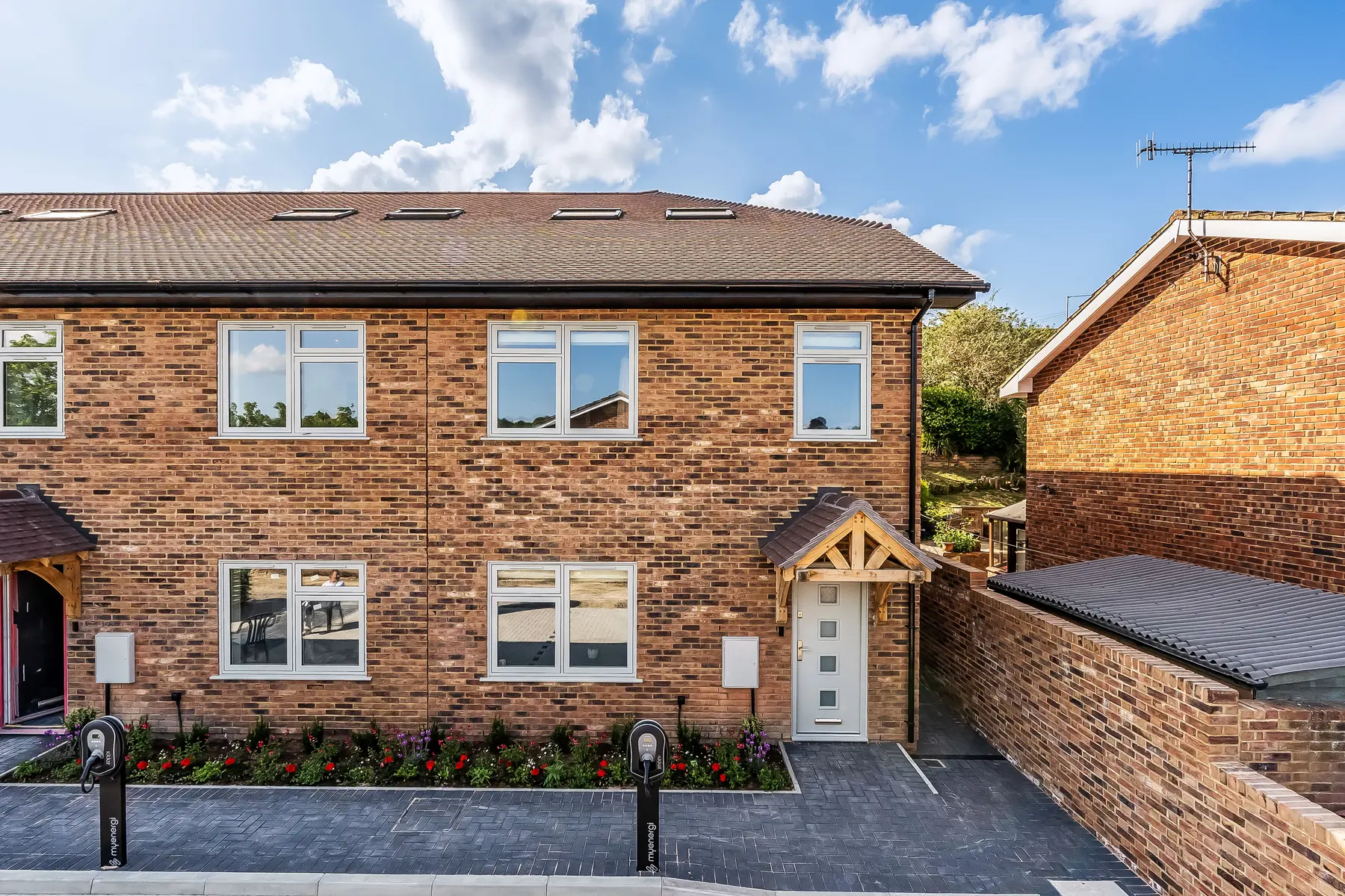 The exterior of North Farm Road, Tunbridge Wells — a new-build family house under a clear sky