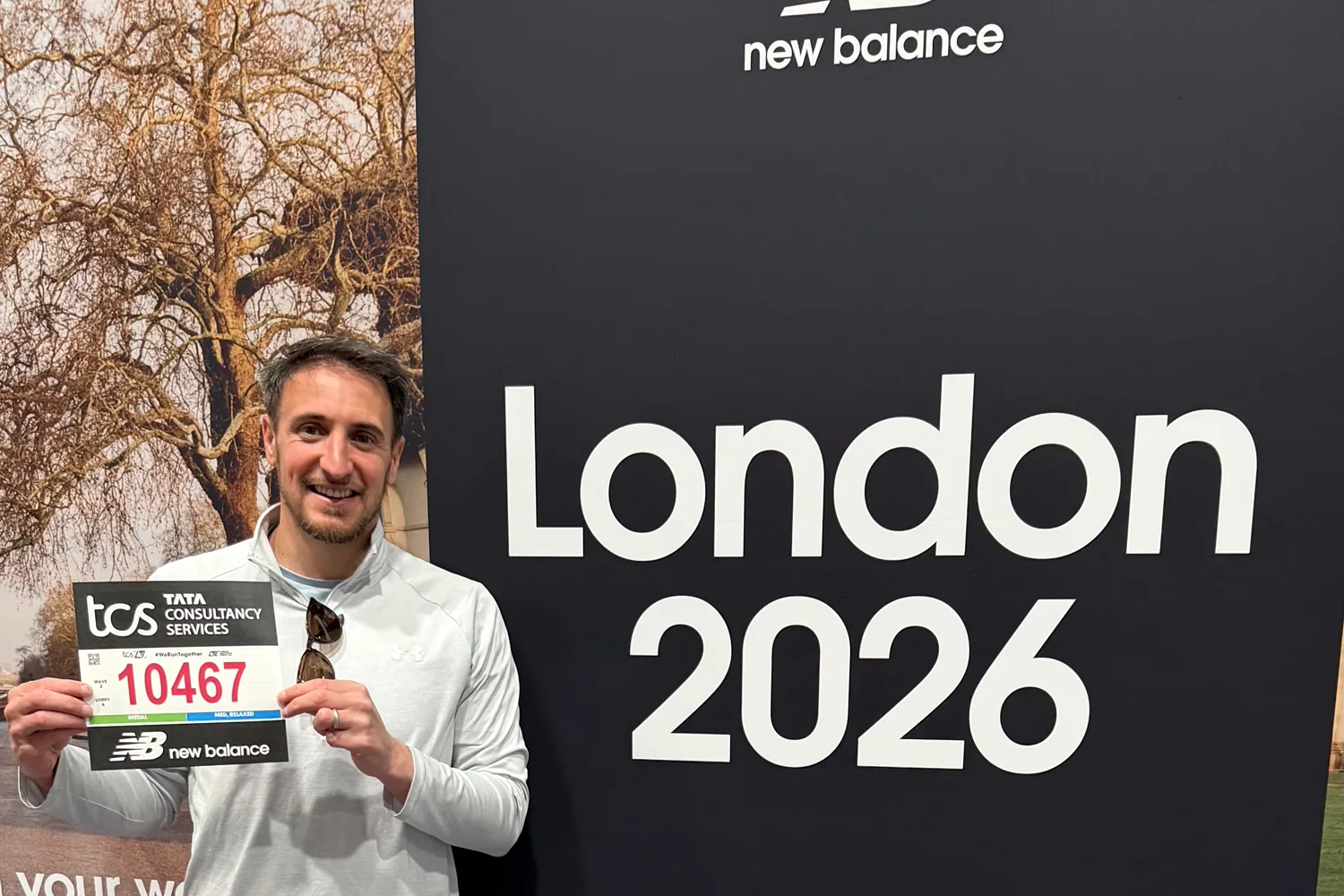 Mike Heath at the TCS London Marathon 2026, holding his race number 10467 at the London 2026 board.