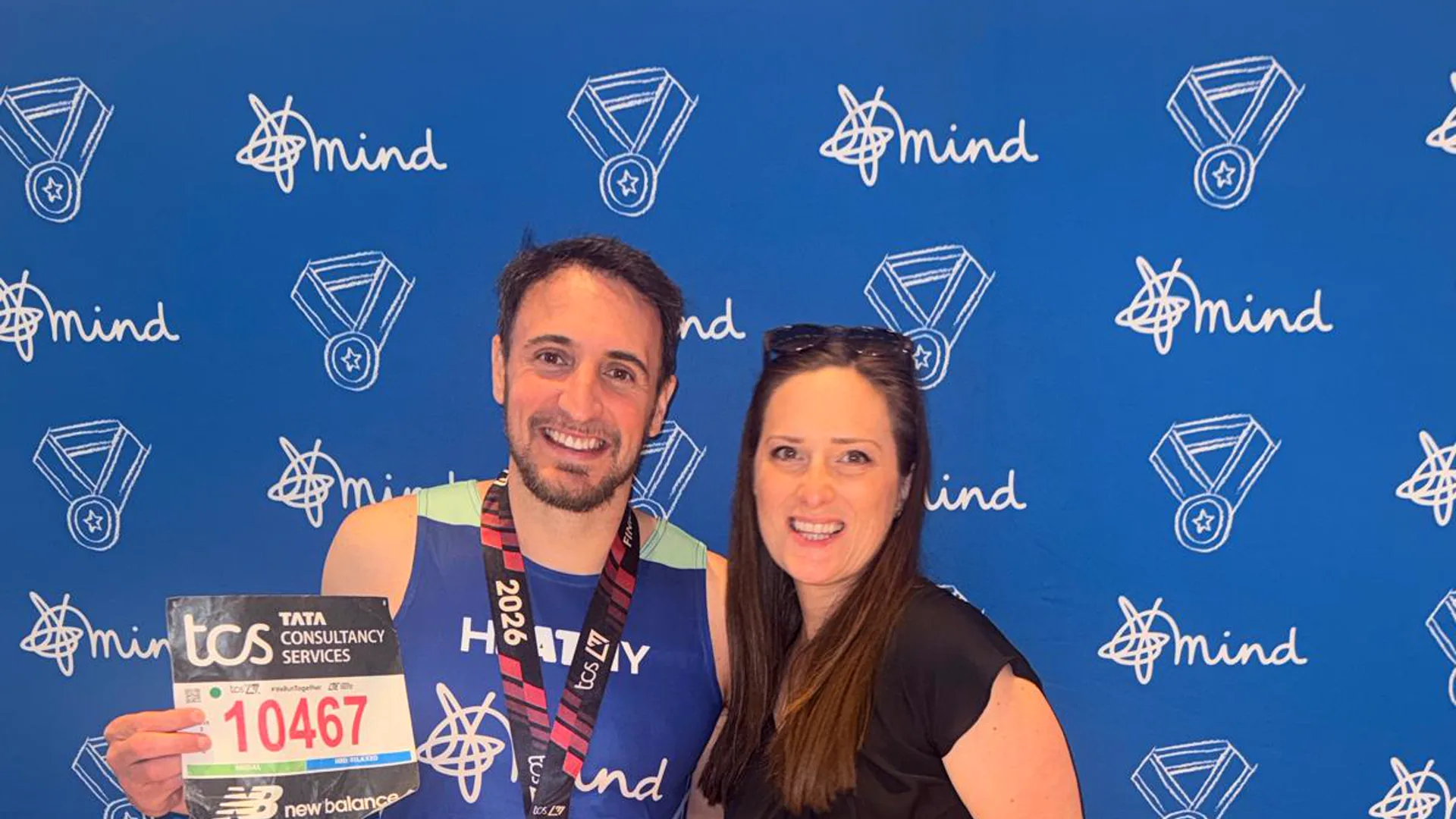 Mike Heath at the Mind finish area after the 2026 London Marathon, in his Mind running vest with his finisher's medal.